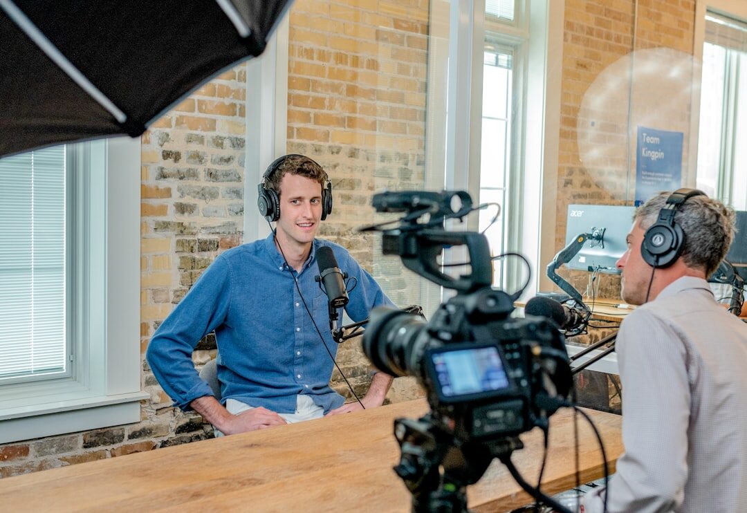 Two journalists conducting a professional interview at a table